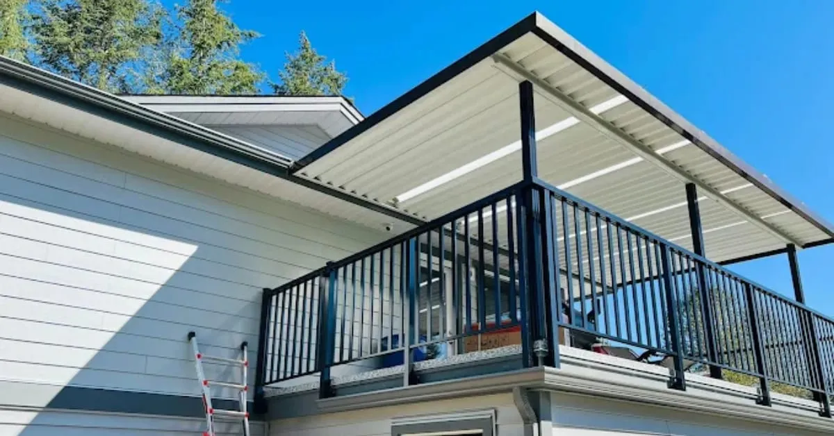 White metal patio cover over a second-floor deck with black aluminum railings